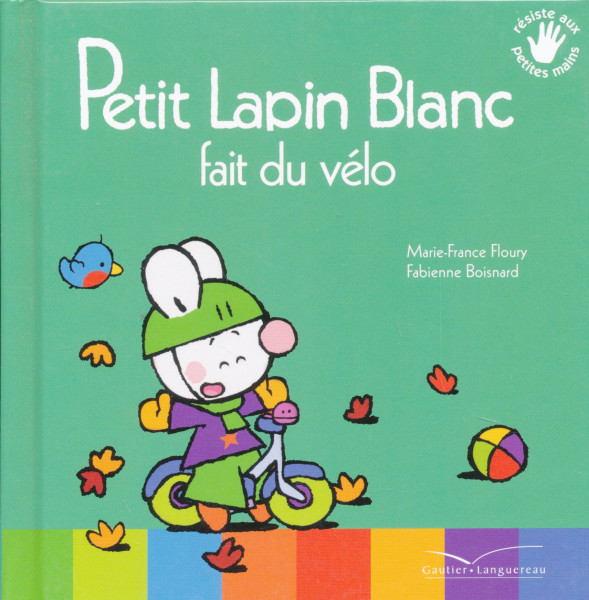 Petit Lapin Blanc fait du vélo